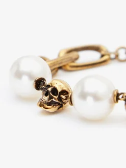 Discount Alexander McQueen Women's Pearl-like Skull Chain Bracelet in Antique Gold